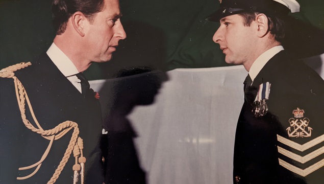 Graham Walker receives medal from Prince Charles aboard HMS York Graham Walker receives medal from Prince Charles aboard HMS York
